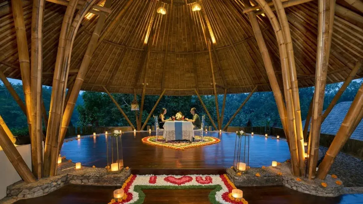 Candlelit dinner set in a bamboo pavilion above the Ubud jungle, Bali