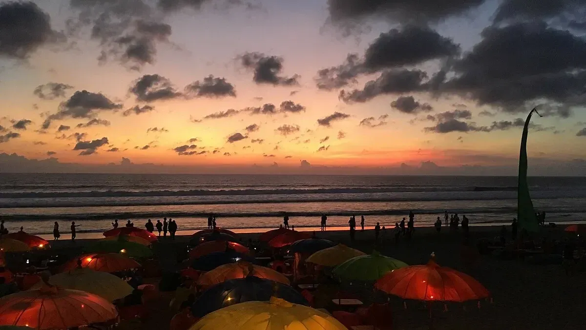 Beanbags and umbrellas on Seminyak beach at sunset, Bali