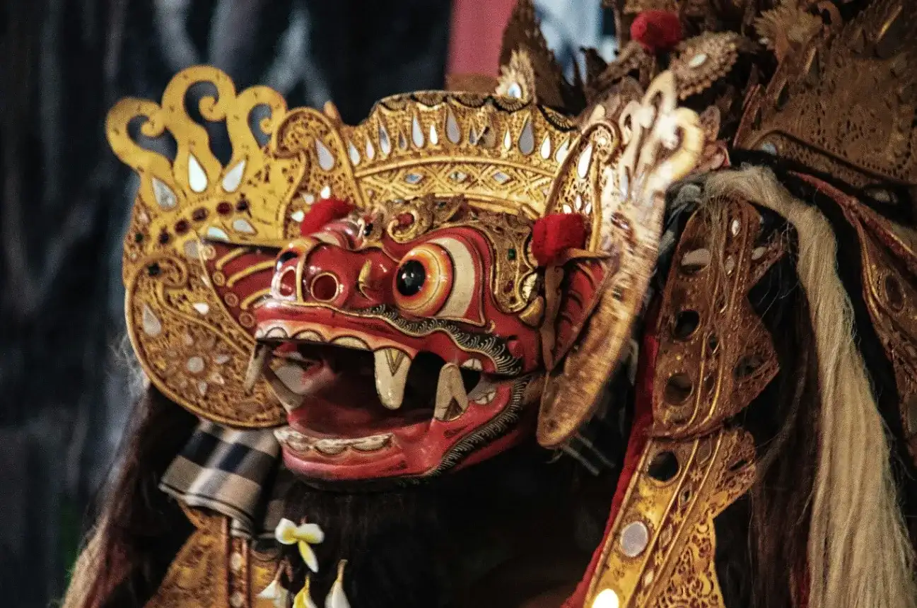 Barong mask in gilded costume during a Barong and Keris dance, Bali