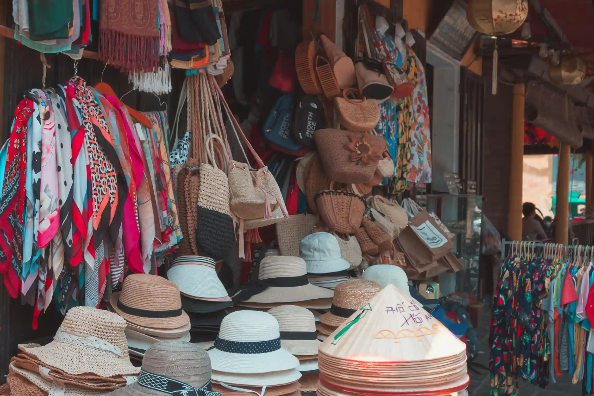 Hats, scarves and woven bags on sale at Ubud Art Market, Bali